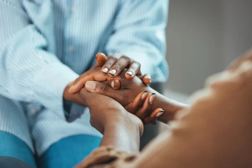 women holding hands with caregiver transformed (1)